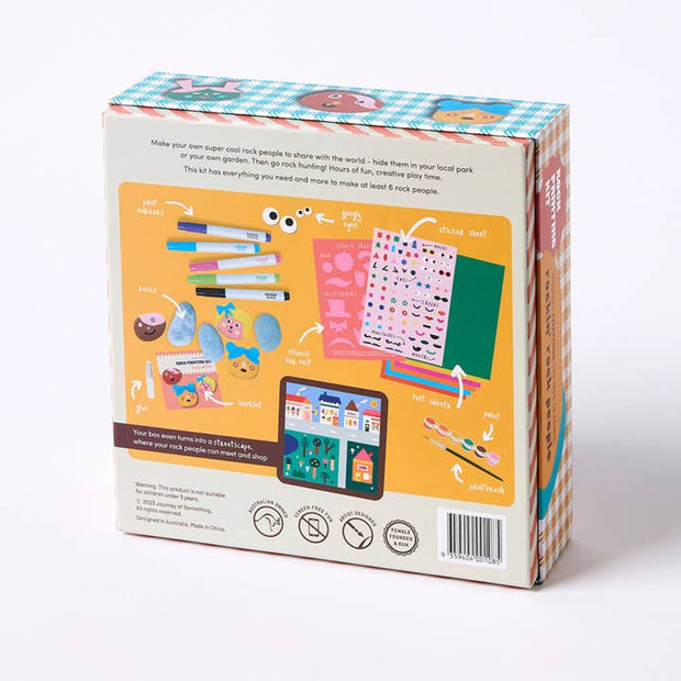 Creative DIY kids activity with paints, stickers, and rocks