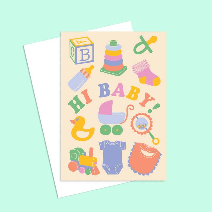 Blank recycled greeting card for new baby featuring pram duck and rattle icons