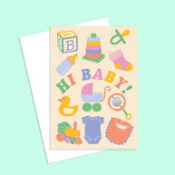 Blank recycled greeting card for new baby featuring pram duck and rattle icons