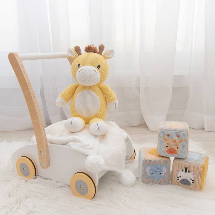 Yellow and white giraffe soft toy with gentle rattle for babies