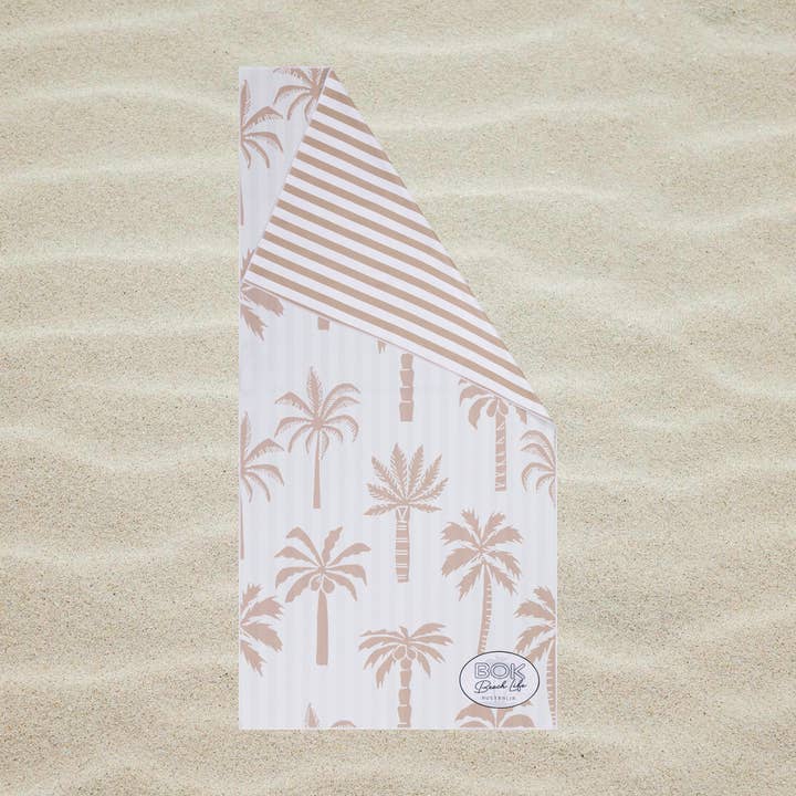 Reversible sand free beach towel with waffle weave fabric and carry bag