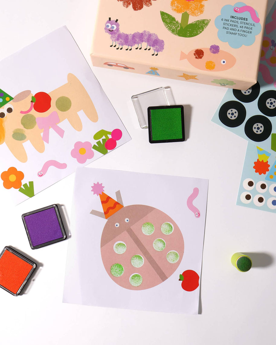Fingerprint art creations of caterpillars, lions and flowers