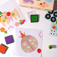 Fingerprint art creations of caterpillars, lions and flowers