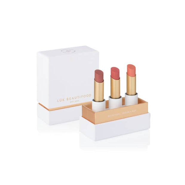 Nude lipstick trio featuring Tea Rose, Nude Pink, and Peach Melon in eco-luxe packaging