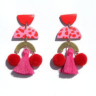 Bold red and pink statement earrings with gold accents