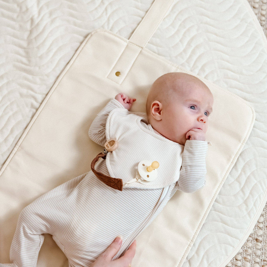 Padded faux leather travel change mat with wavy quilted stitching