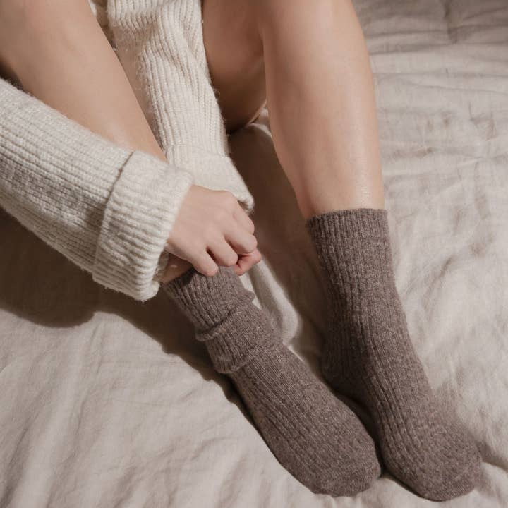 Bed and Butter The Comfiest Socks Light Chocolate cashmere wool ankle socks being put on