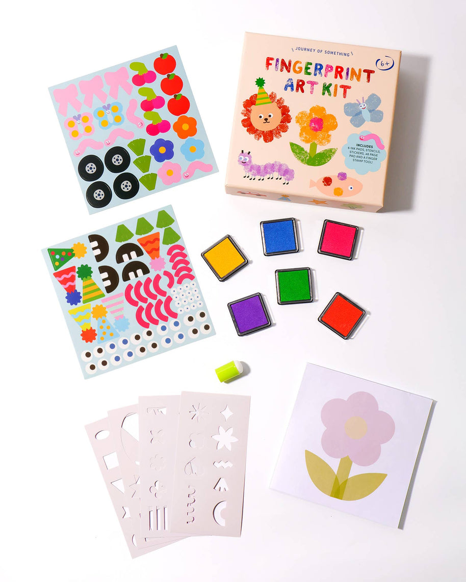 Kids craft kit contents: ink pads, stencils, stickers and finger stamp tool