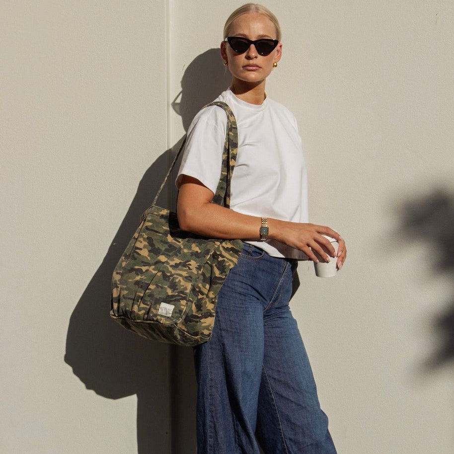 Array Everyday Pocket Tote Camo carried on shoulder