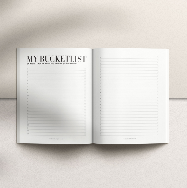 Inspirational bucket list book with stylish black hardcover design