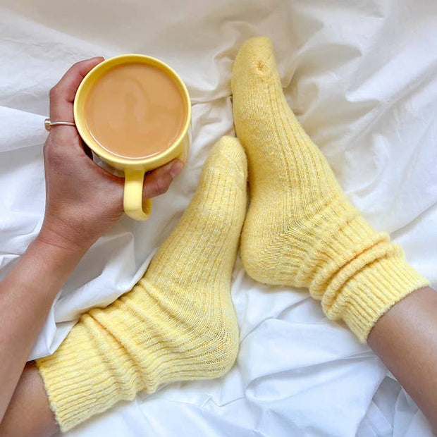 Bed and Butter The Comfiest Socks Yellow cashmere wool ankle socks worn in bed with a cup of tea