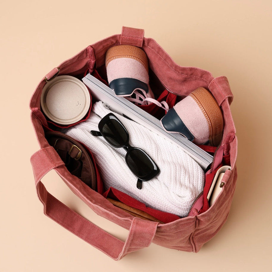 Blush tote bag with six internal organising pockets