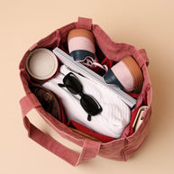 Blush tote bag with six internal organising pockets