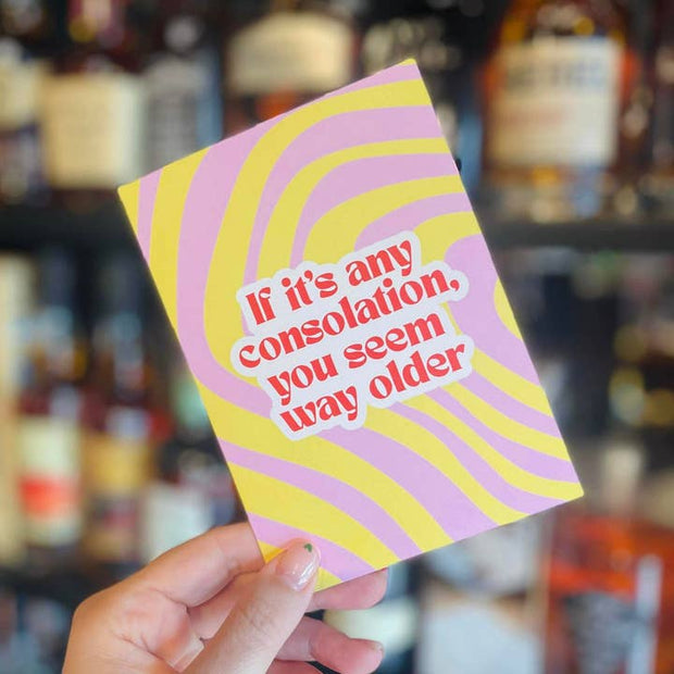 Bold orange typography on pink and yellow swirl pattern
