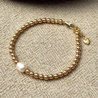 Boss + Me grounding hematite bracelet in warm gold