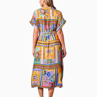 Model wearing the Kaena Dress in Multi Print with collared neckline, button front, short sleeves and optional belt.