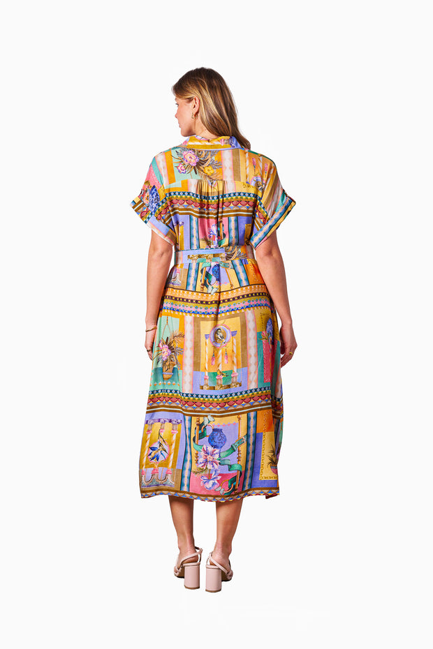 Model wearing the Kaena Dress in Multi Print with collared neckline, button front, short sleeves and optional belt.