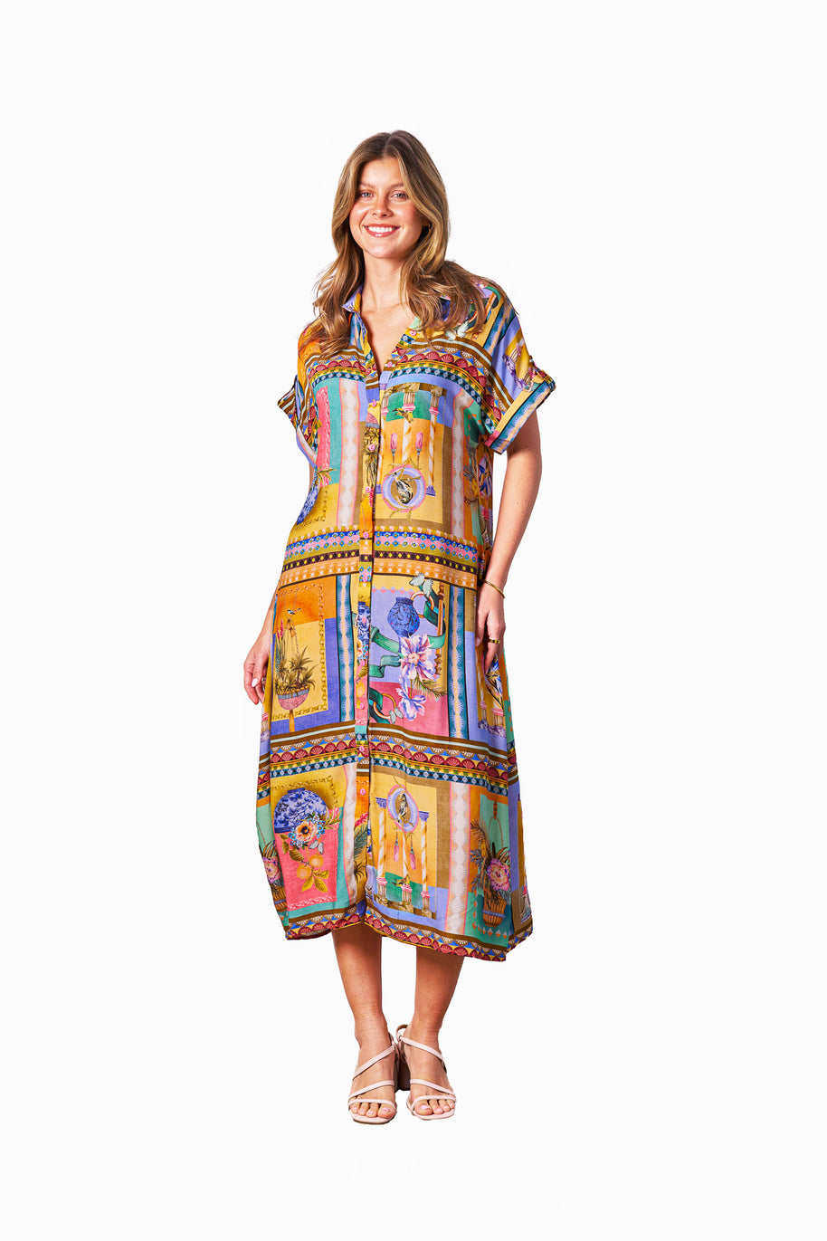 Model wearing the Kaena Dress in Multi Print with collared neckline, button front, short sleeves and optional belt.