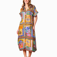 Model wearing the Kaena Dress in Multi Print with collared neckline, button front, short sleeves and optional belt.