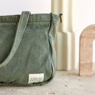 Compact six pocket cotton canvas mini tote with antique gold hardware
