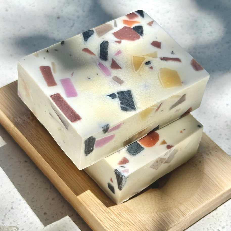 Cooki Mineral Mud Sea Salt Cold Process Soap bars stacked on bamboo dish