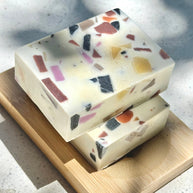 Cooki Mineral Mud Sea Salt Cold Process Soap bars stacked on bamboo dish