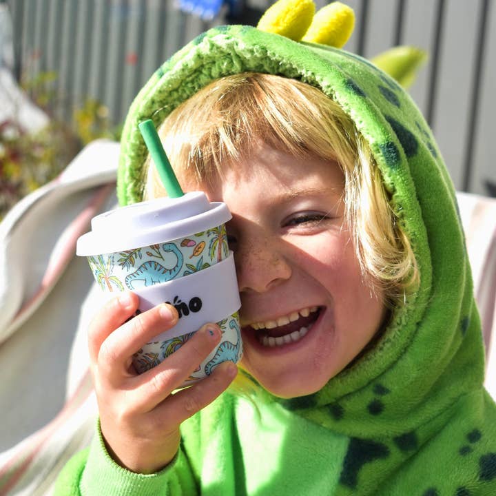 Eco-friendly bamboo kids cup with colourful cartoon dinosaur print on mint green background