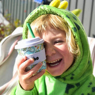 Eco-friendly bamboo kids cup with colourful cartoon dinosaur print on mint green background