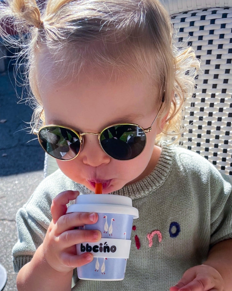 Eco-friendly bamboo kids cup with white goose print on dusty blue background