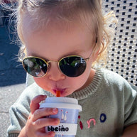 Eco-friendly bamboo kids cup with white goose print on dusty blue background