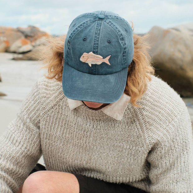 Embroidered snapper fish detail on faded stone dad cap
