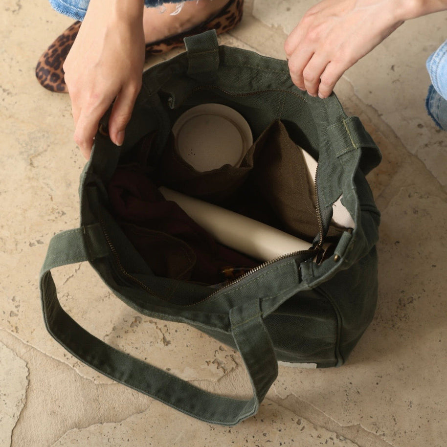 Forest green tote bag with six internal organising pockets