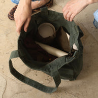 Forest green tote bag with six internal organising pockets