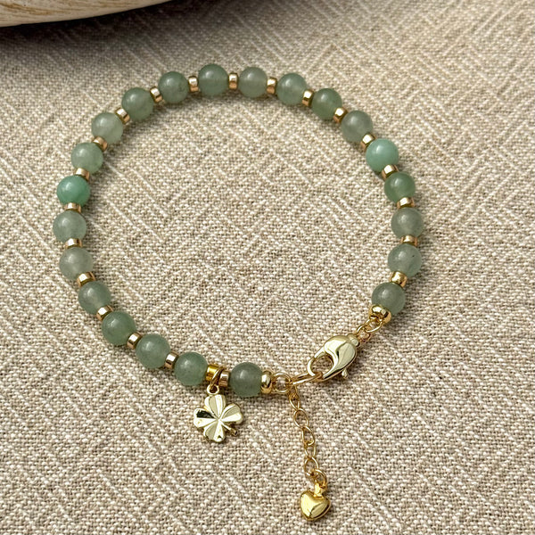 Green jade beaded bracelet with four leaf clover charm