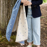 Holly Heart Scarf styled in blue tone with delicate cream hearts