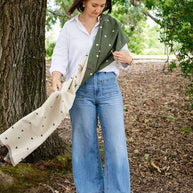 Holly Heart Scarf styled in earthy olive with delicate cream hearts