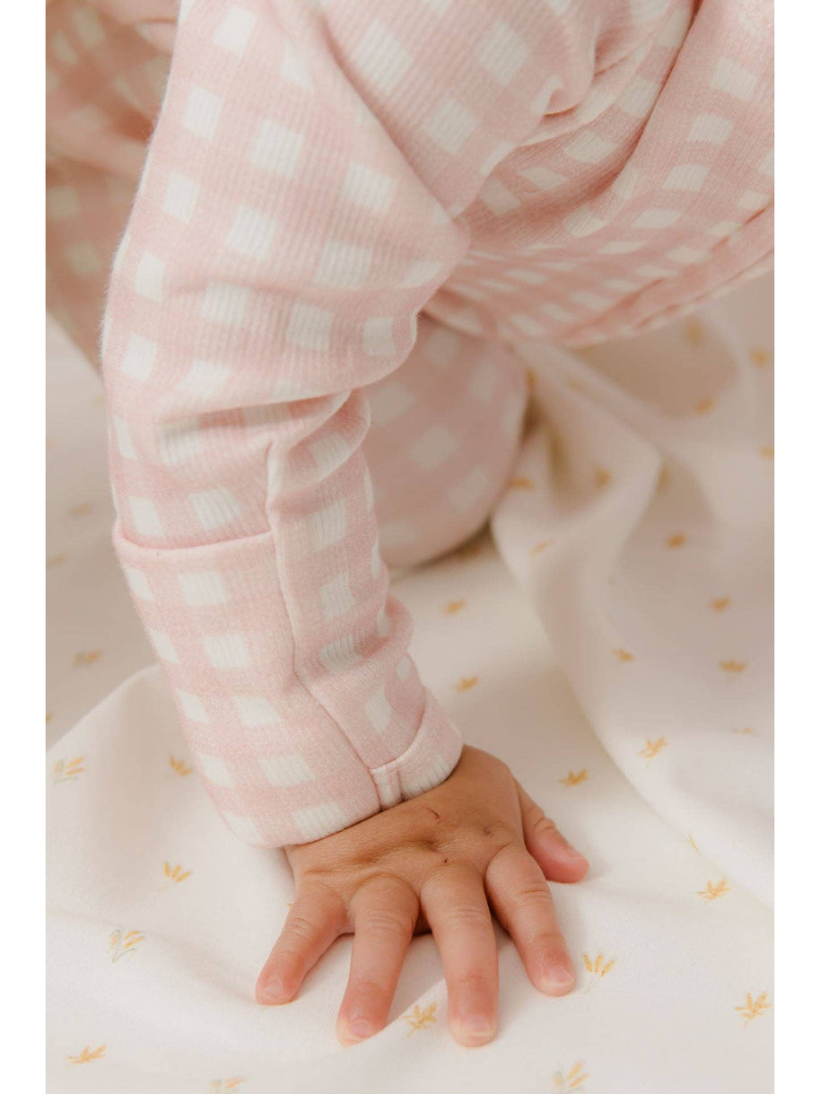 Homegrown Kids cosy newborn growsuit with embroidered floral detail and ribbed fabric