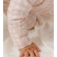 Homegrown Kids cosy newborn growsuit with embroidered floral detail and ribbed fabric