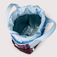 Insulated drawstring lunch bag with front zip pocket