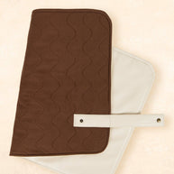 Kiin Baby change mat rolled up with snap closure