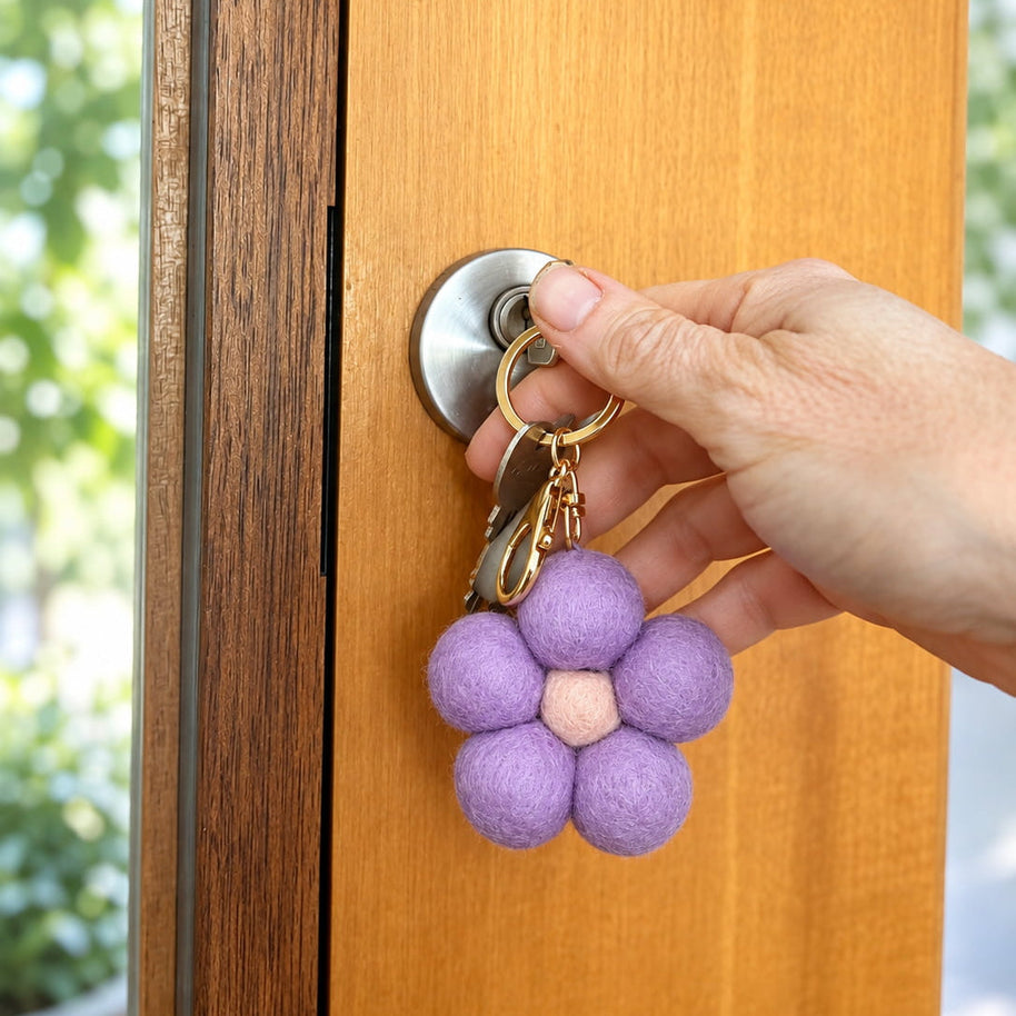 Lilac Felt Flower Keychain attached to bag