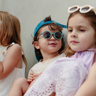 Sage green children’s sunglasses with round acrylic lenses