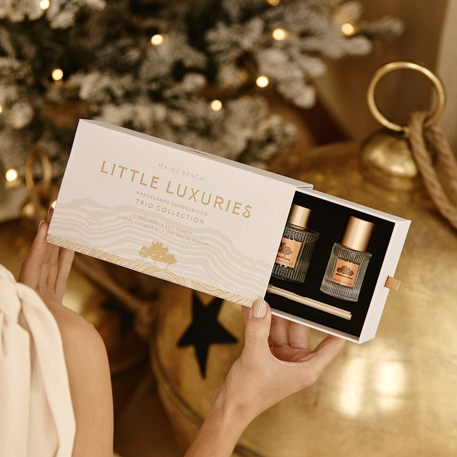 Mini candle, diffuser and perfume in gold packaging