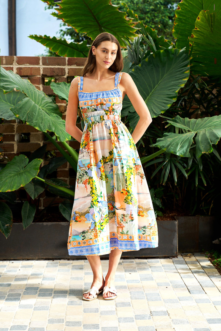 Model wearing the Midi Dress in Pastel Coast with a square neckline, elasticated waist and coastal print.