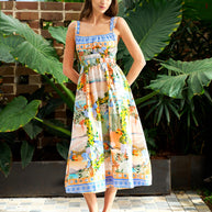 Model wearing the Midi Dress in Pastel Coast with a square neckline, elasticated waist and coastal print.