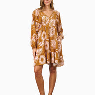 Model wearing the Aaliyah Dress in Brown Pink featuring a v-neckline, puff sleeves, tiered skirt and relaxed fit.