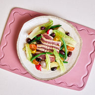 Pink chopping board with non-slip grip and juice groove
