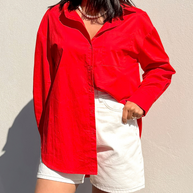 Red cotton button-down shirt with chest pocket and curved hem