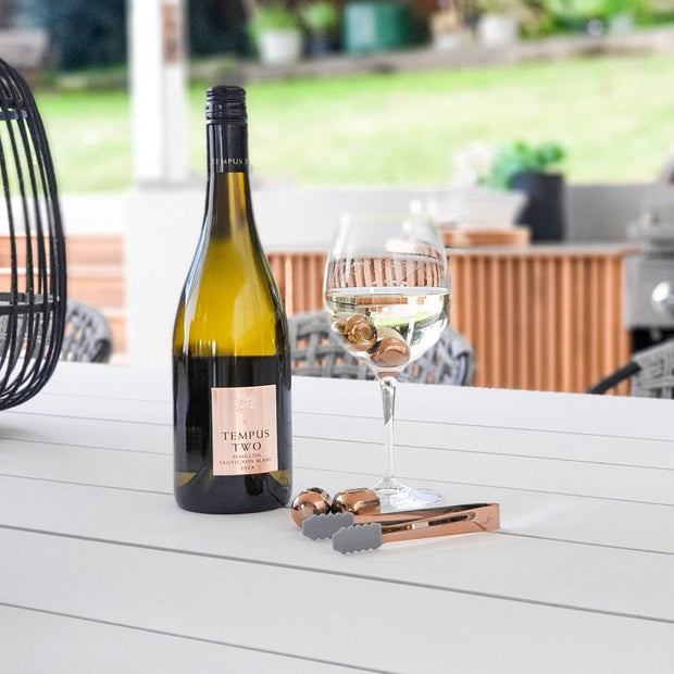 Reusable wine chiller pearls with copper tongs