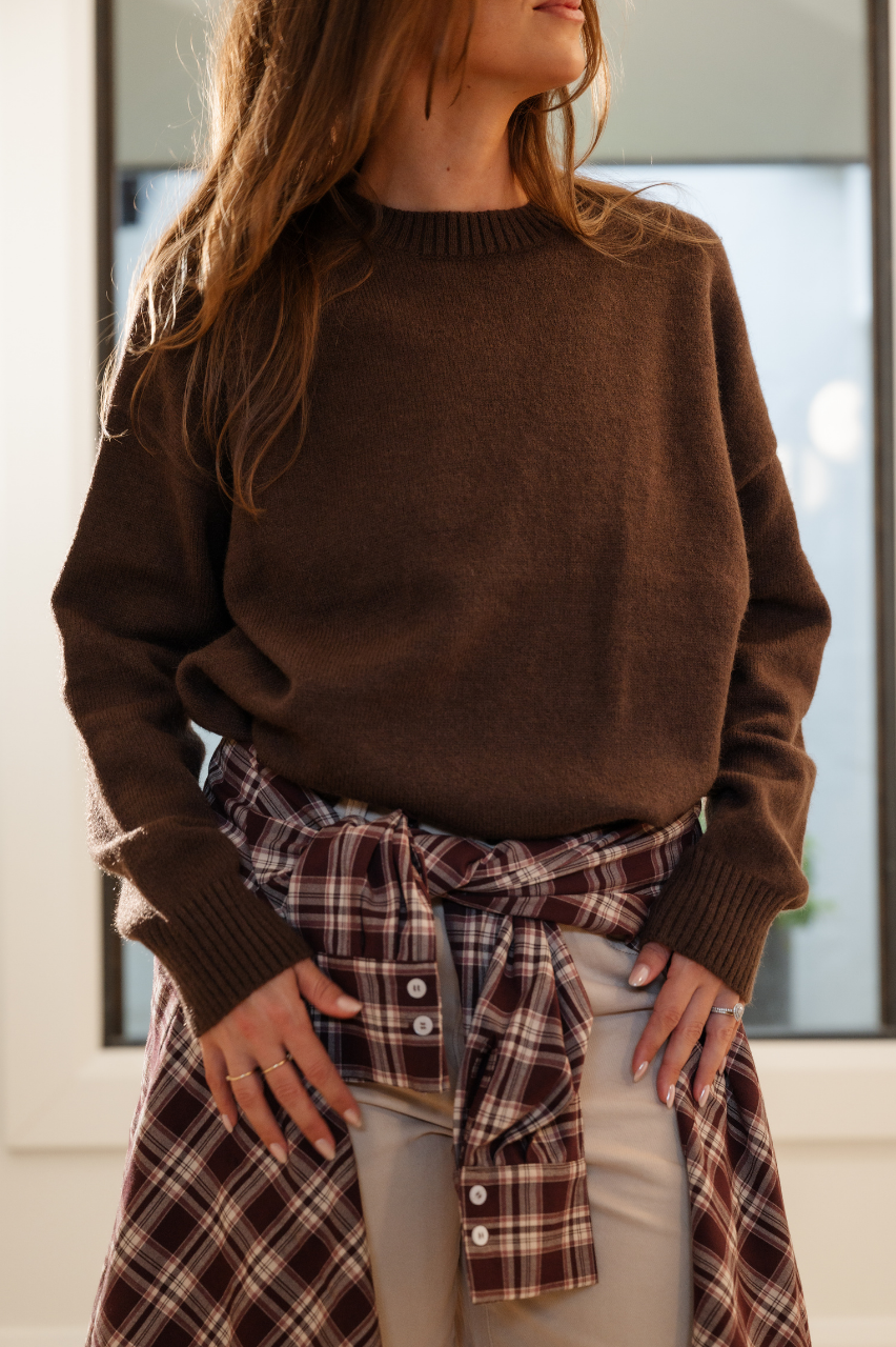 Rich chocolate brown dropped shoulder knit with ribbed neckline and cuffs